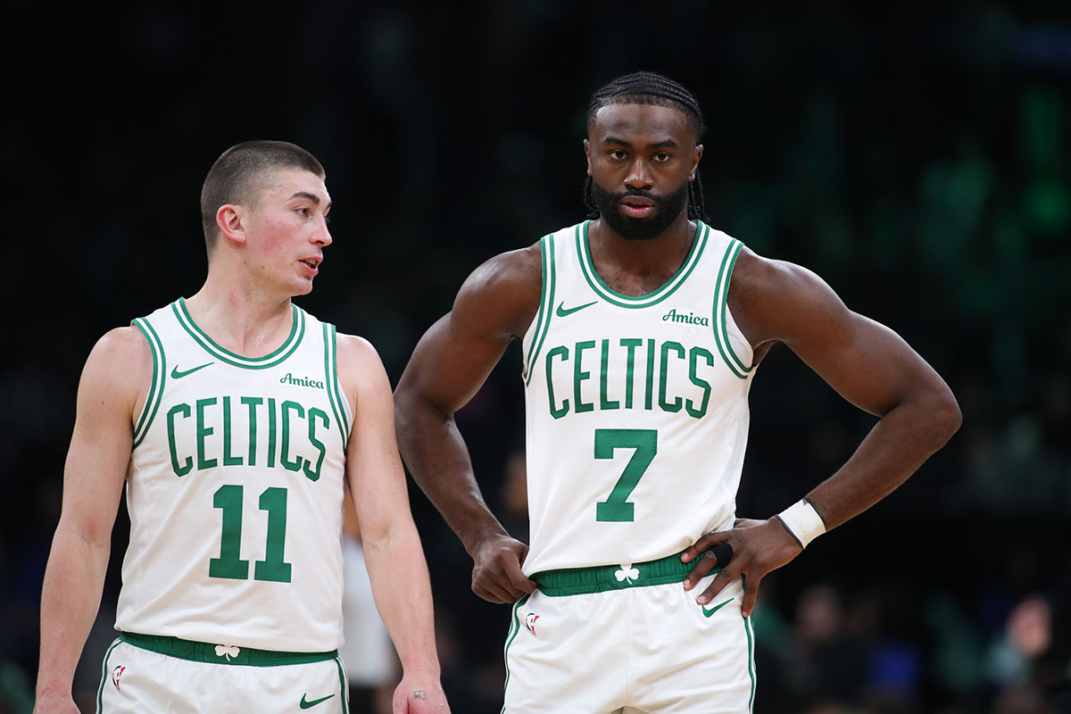 Boston Celtics forward Jaylen Brown (7) and Boston Celtics guard Payton Pritchard (11) talk during the first half against the Memphis Grizzlies at TD Garden.