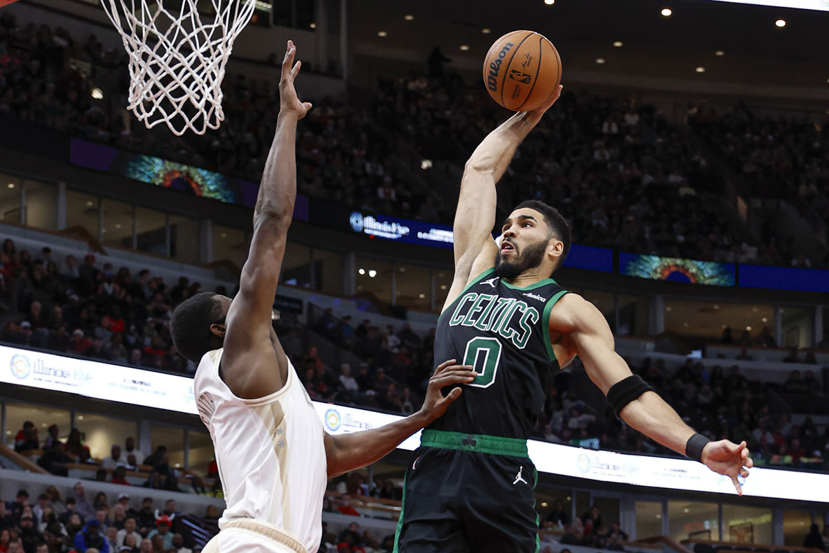 Celtics forward Jayson Tatum (0) goes to the basket against Chicago Bulls forward Jalen Smith (7) during the second half at United Center