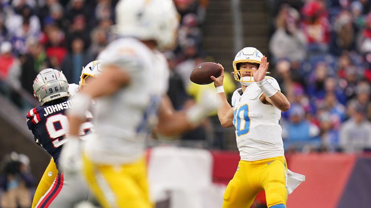 Los Angeles Chargers quarterback Justin Herbert (10) throws a touchdown pass to wide receiver Ladd McConkey (15) against the New England Patriots in the third quarter at Gillette Stadium.