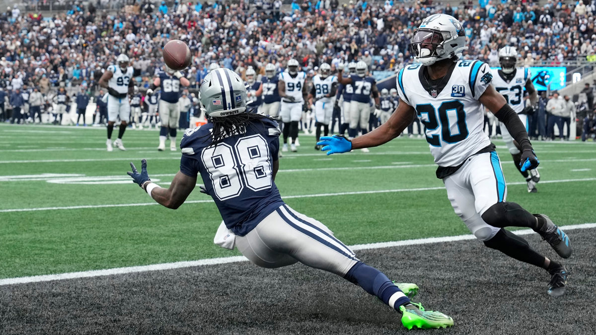 Dallas Cowboys wide receiver CeeDee Lamb (88) scores a touchdown as Carolina Panthers safety Jordan Fuller (20) defends in the second quarter at Bank of America Stadium.
