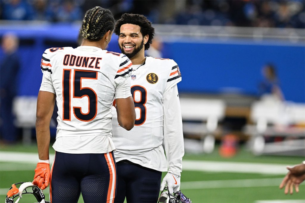 Chicago Bears quarterback Caleb Williams (18) greets wide receiver Rome Odunze (15) during pregame warmups before their game against the Detroit Lions at Ford Field. 
