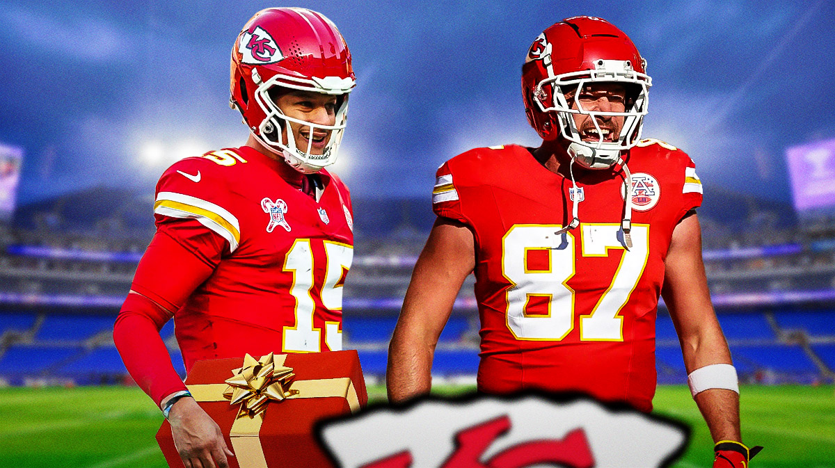 Photo: Patrick Mahomes holding a christmas present smiling beside Travis Kelce, both in Chiefs jerseys