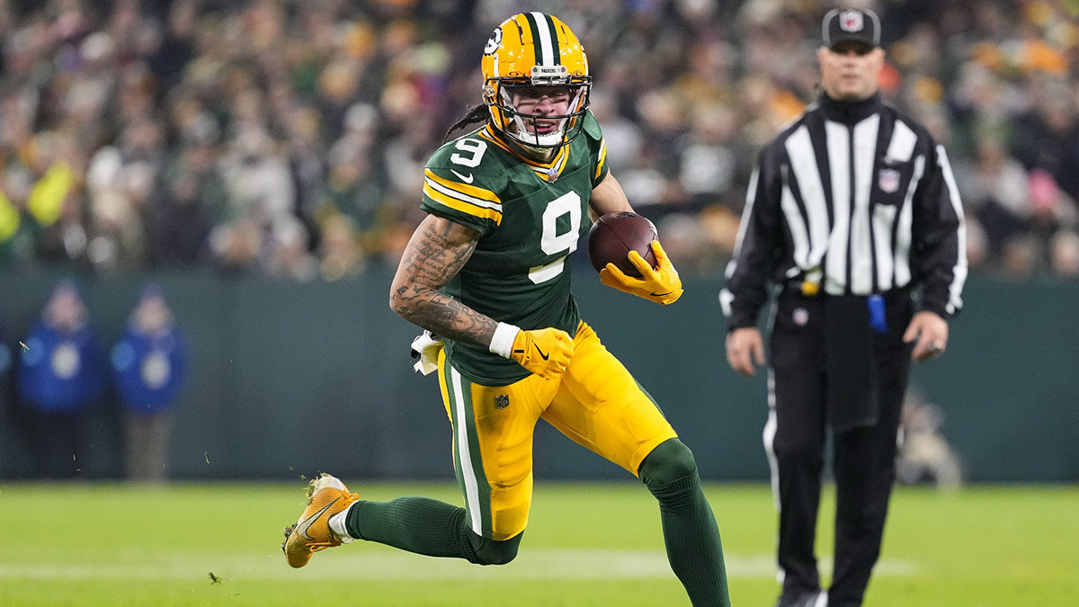 Green Bay Packers wide receiver Christian Watson (9) rushes with the football during the second quarter against the New Orleans Saints at Lambeau Field. 