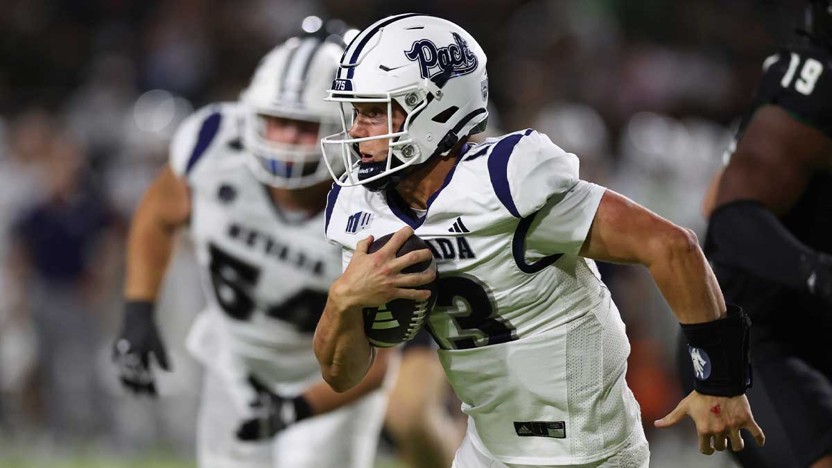 Nevada Wolf Pack quarterback Chubba Purdy (13) gains yards against the Hawaii Rainbow Warriors during the third quarter at the Clarence T.C. Ching Athletics Complex. 