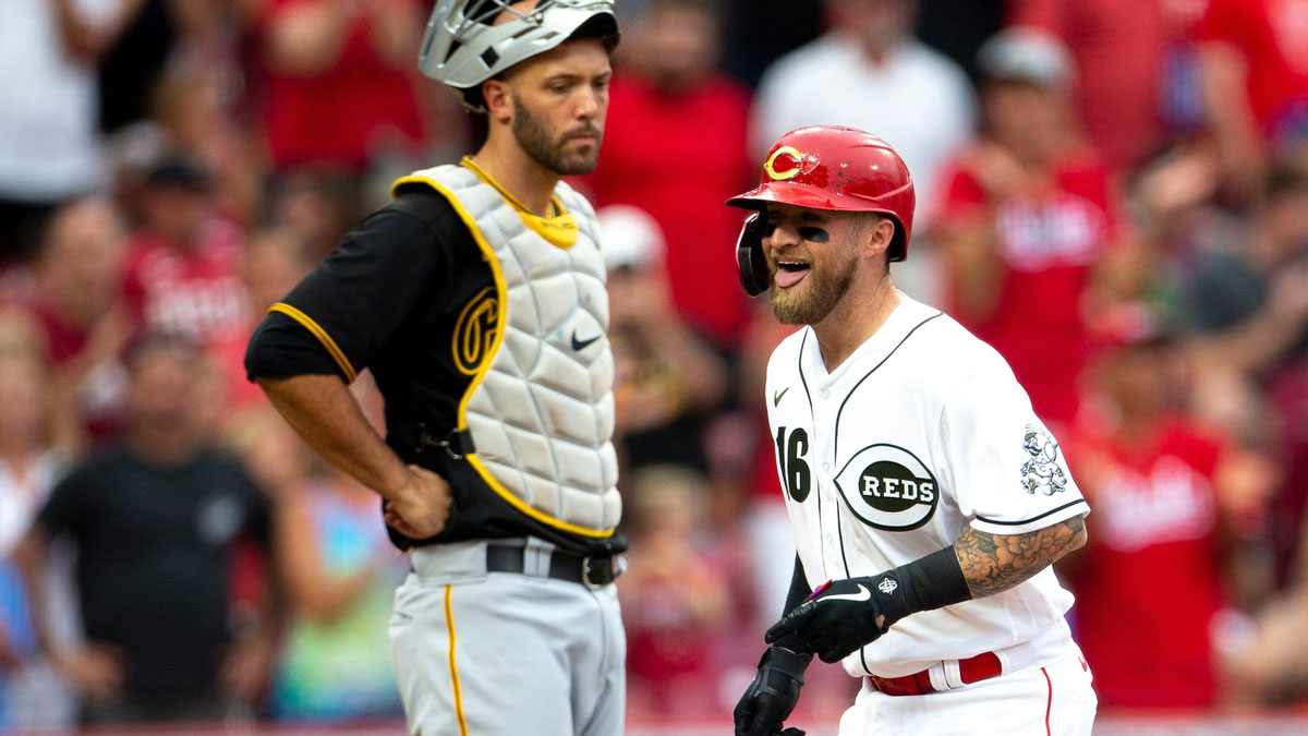 Cincinnati Reds catcher Tucker Barnhart (16) smiles as he comes home after hitting a 3-run home run in the first inning of the MLB baseball game between the Cincinnati Reds and the Pittsburgh Pirates on Friday, Aug. 6, 2021, at Great American Ball Park in Cincinnati. Cincinnati Reds Pittsburgh Pirates.