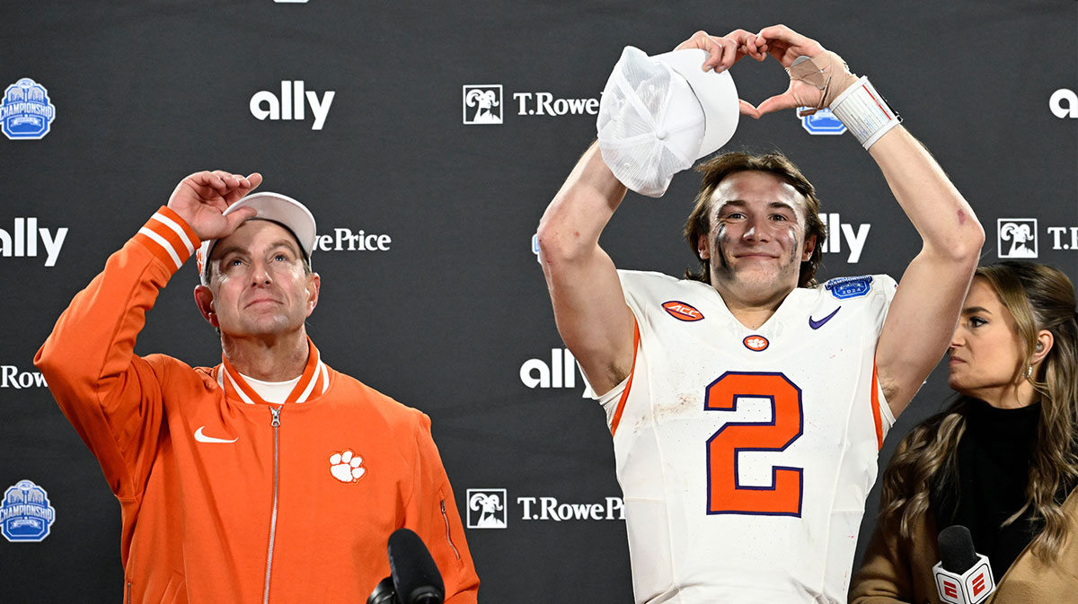 Clemson Tigers head coach Dabo Swinney, and quarterback Cade Klubnik (2) celebrate after winning the 2024 ACC Championship game against the Southern Methodist Mustangs at Bank of America Stadium.