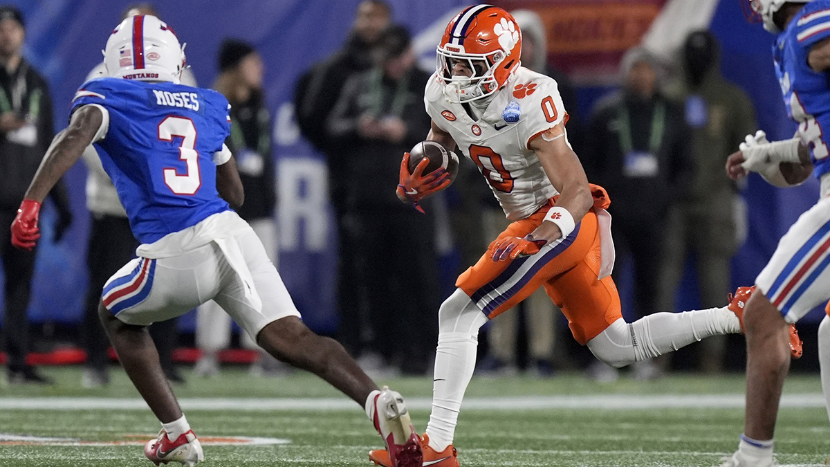 Dec 7, 2024; Charlotte, NC, USA; Clemson Tigers wide receiver Antonio Williams (0) runs against Southern Methodist Mustangs safety Ahmaad Moses (3) during the second quarter in the 2024 ACC Championship game at Bank of America Stadium.