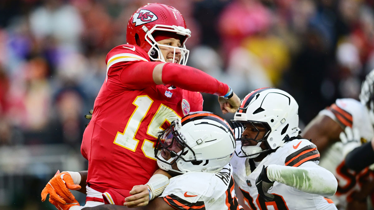 Cleveland Browns defensive tackle Mike Hall Jr. (51) and linebacker Devin Bush (30) rush Kansas City Chiefs quarterback Patrick Mahomes (15) during the second half at Huntington Bank Field.