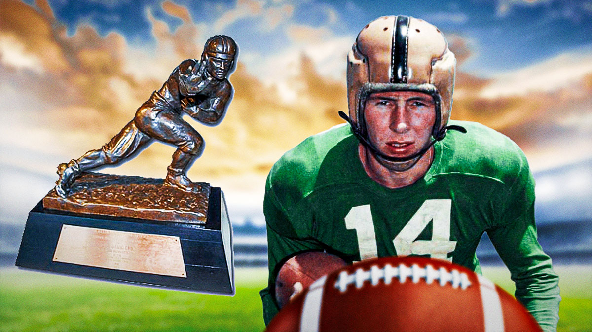 Johnny Lattner (Notre Dame) with the Heisman Trophy