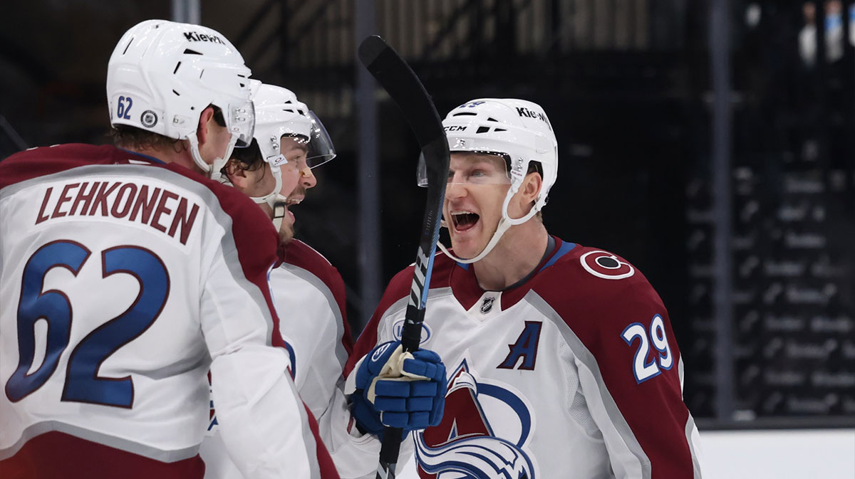 Colorado Avalanche left wing Artturi Lehkonen (62) celebrates a goal with center Nathan MacKinnon (29) during the third period at Delta Center.