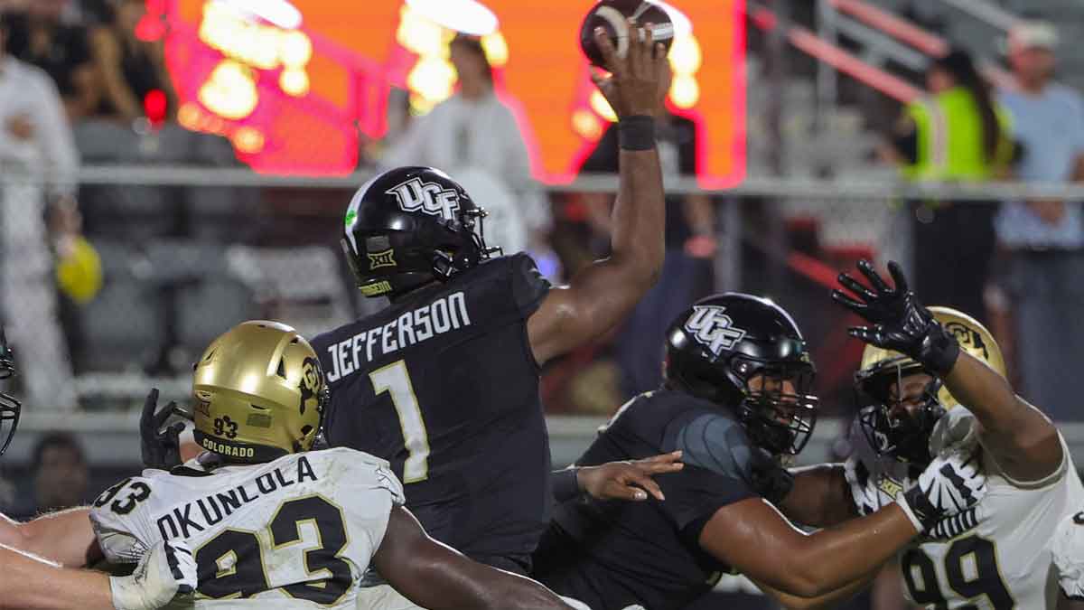 UCF Knights quarterback KJ Jefferson (1) passes the ball during the second half against the Colorado Buffaloes at FBC Mortgage Stadium.
