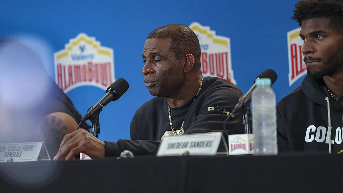 Colorado Buffaloes head coach Deion Sanders talks with the media after the game against the Brigham Young Cougars at Alamodome.