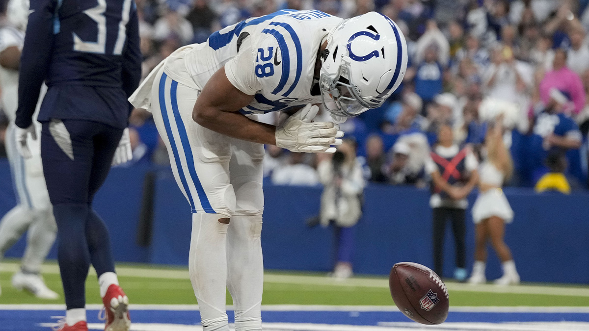 Indianapolis Colts running back Jonathan Taylor (28) celebrates after rushing for a touchdown during a game against the Tennessee Titans at Lucas Oil Stadium.