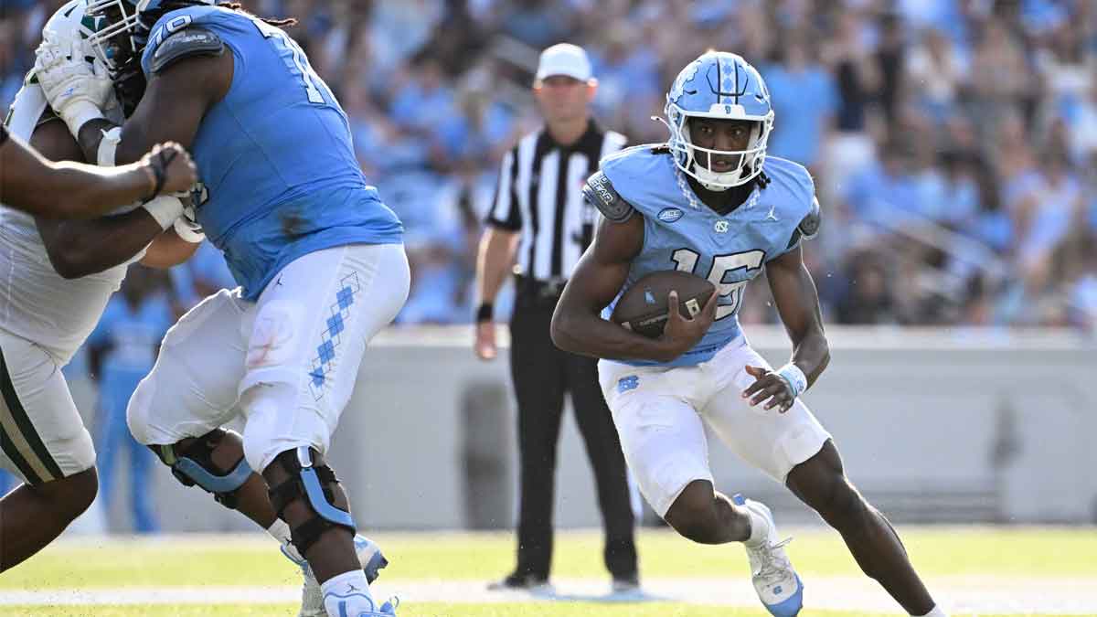 Sep 7, 2024; Chapel Hill, North Carolina, USA; North Carolina Tar Heels quarterback Conner Harrell (15) runs in the third quarter at Kenan Memorial Stadium.