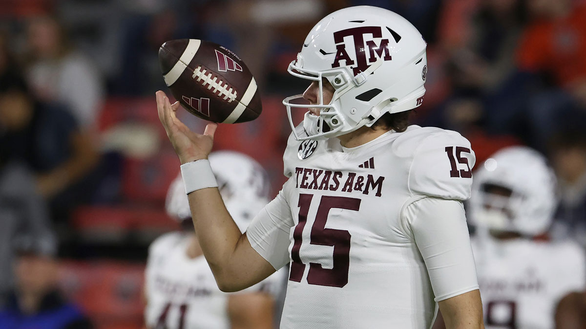 Texas A&M Aggies quarterback Conner Weigman (15) warms up before the game against the Auburn Tigers at Jordan-Hare Stadium.