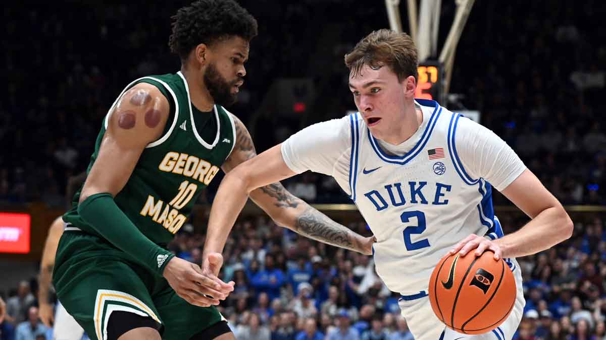 Duke Blue Devils forward Cooper Flagg (2) drives to the basket as George Mason Patriots forward Zach Anderson (10) defends during the first half at Cameron Indoor Stadium.