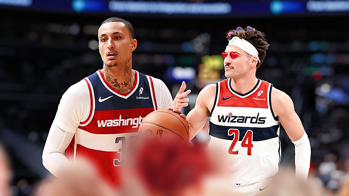 Corey Kispert (with heart eyes) smiles at Kyle Kuzma