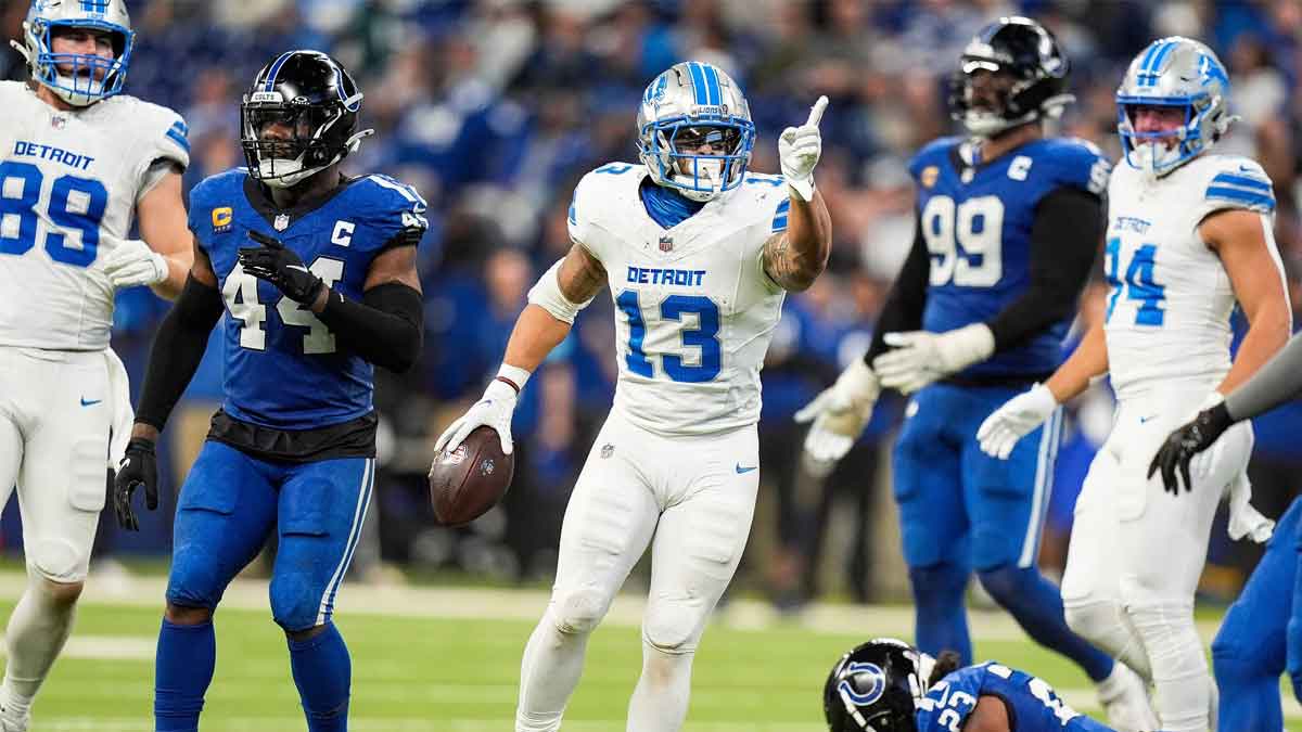 Detroit Lions running back Craig Reynolds (13) celebrates a first down against Indianapolis Colts during the second half at Lucas Oil Stadium in Indianapolis, Ind. on Sunday, Nov. 24, 2024.