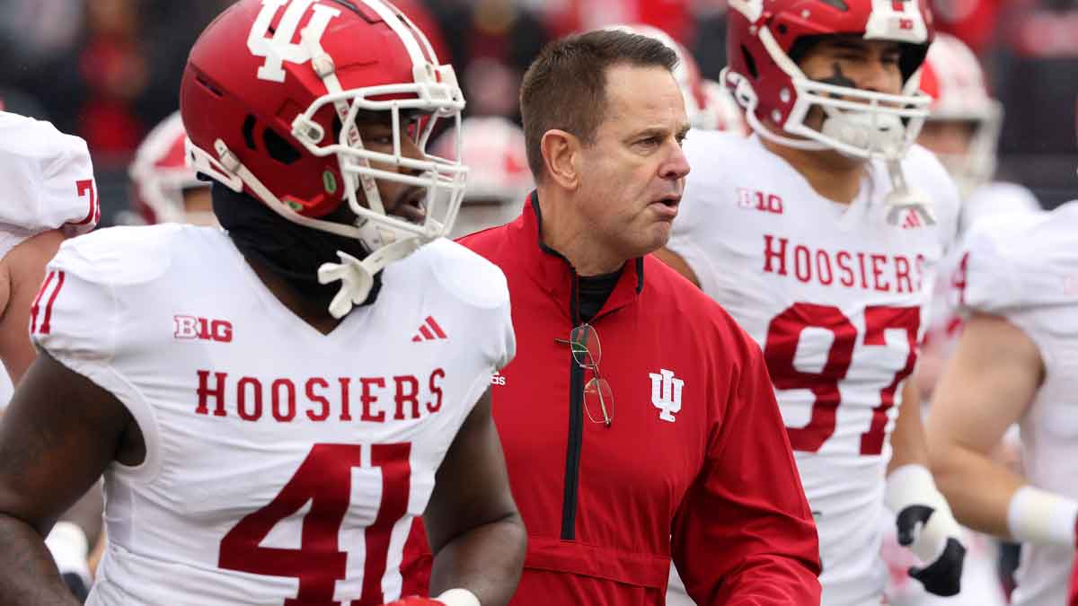 Indiana Hoosiers head coach Curt Cignetti runs with his team before the game against the Ohio State Buckeyes at Ohio Stadium.