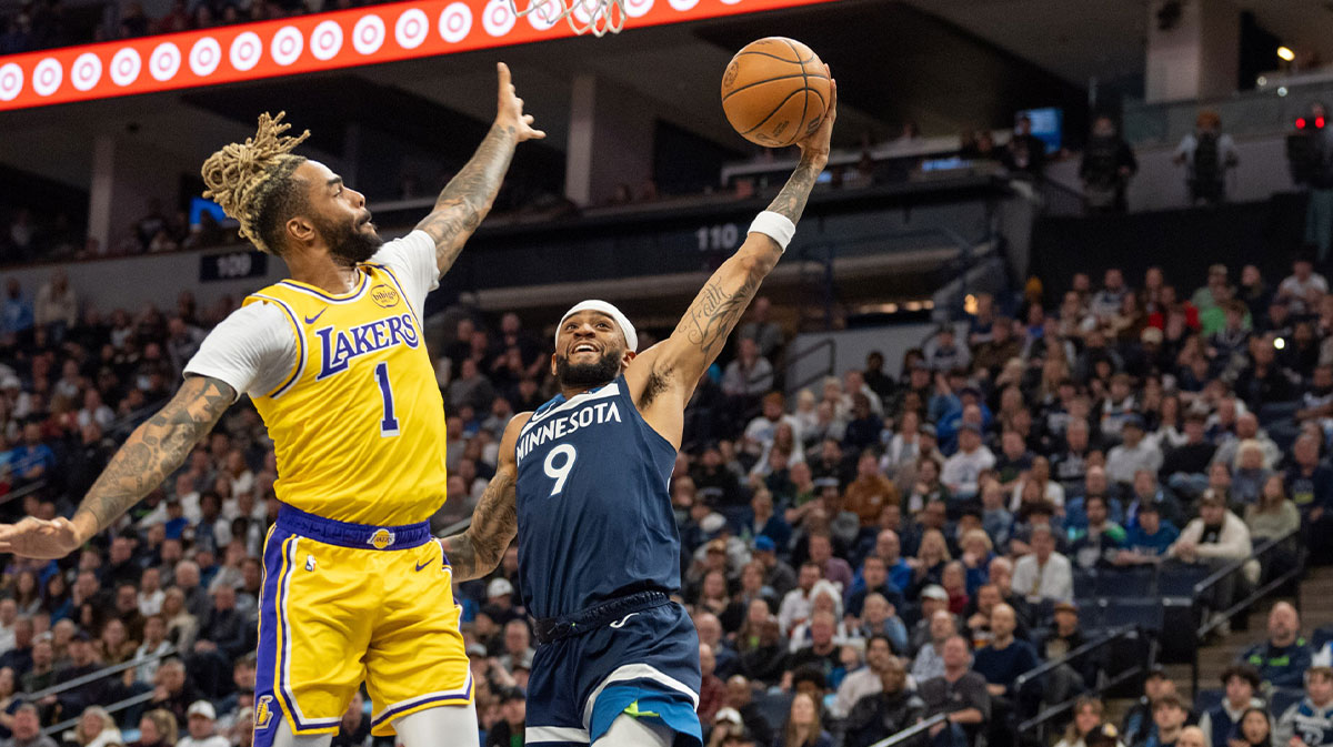 Los Angeles Lakers guard D'Angelo Russell (1) comes back to defend against Minnesota Timberwolves guard Nickeil Alexander-Walker (9) in the fourth quarter at Target Center.