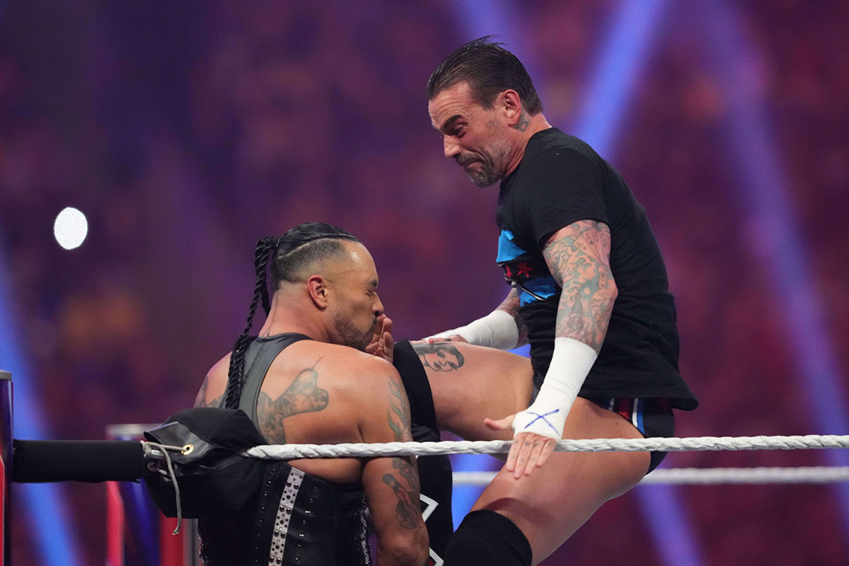 Damian Priest getting kneed in the face by CM Punk at the Royal Rumble.