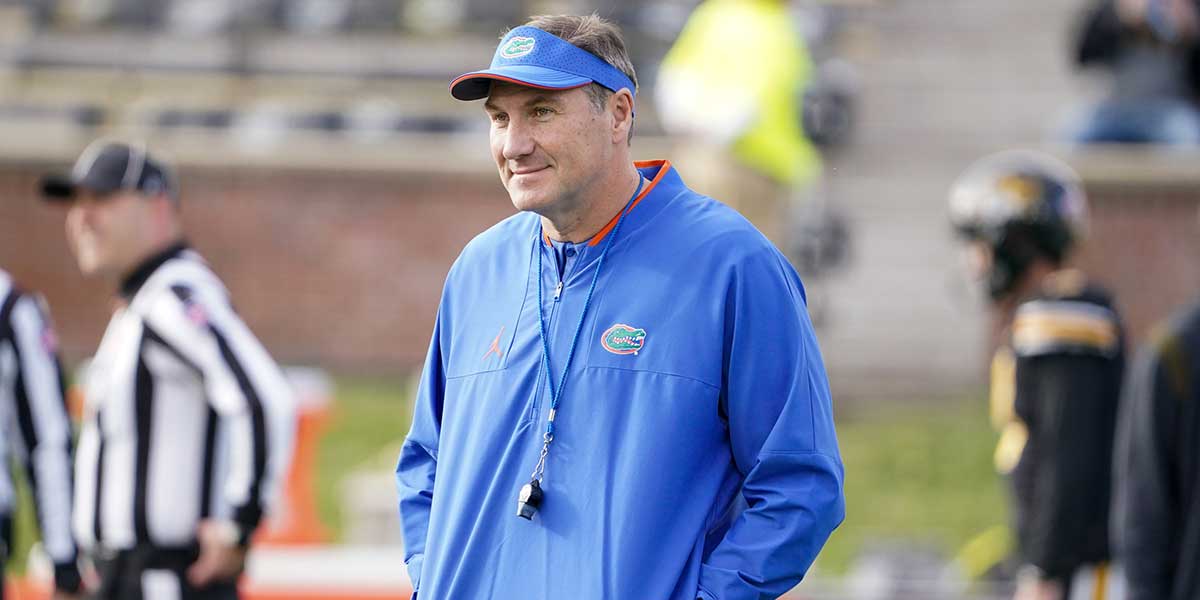 Florida Gators head coach Dan Mullen watches team warm ups against the Missouri Tigers before the game at Faurot Field at Memorial Stadium.