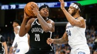 Brooklyn Nets center Day'Ron Sharpe (20) drives to the basket as Memphis Grizzlies forward Lamar Stevens (24) defends during the second half at FedExForum.