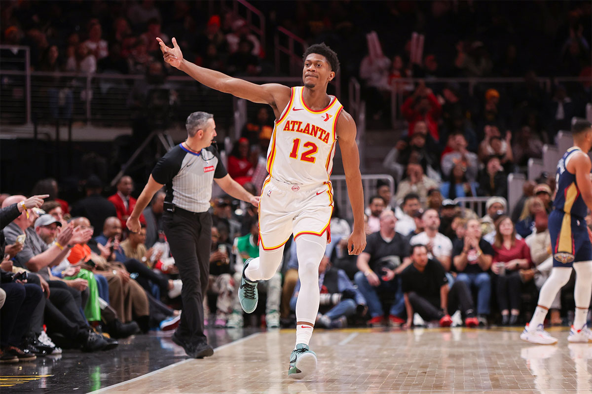 Atlanta Hawks forward De'Andre Hunter (12) reacts after a three-pointer against the New Orleans Pelicans in the fourth quarter at State Farm Arena. 