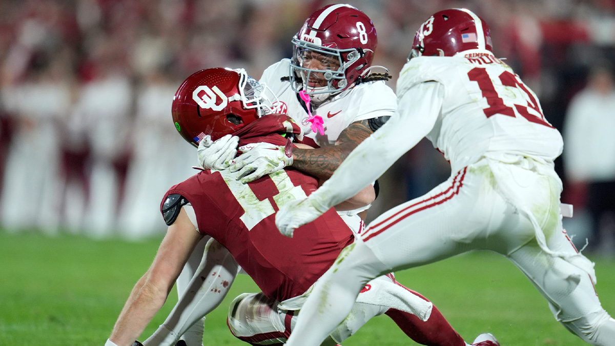 Alabama Crimson Tide defensive back DeVonta Smith (8) brings down /s110/ during a college football game between the University of Oklahoma Sooners (OU) and the Alabama Crimson Tide at Gaylord Family - Oklahoma Memorial Stadium in Norman, Okla., Saturday, Nov. 23, 2024.