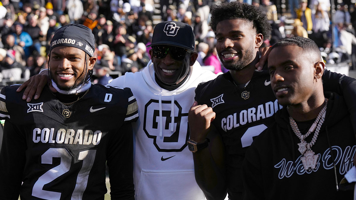 Nov 29, 2024; Boulder, Colorado, USA; Colorado Buffaloes safety Shilo Sanders (21) and head coach Deion Sanders and quarterback Shedeur Sanders (2) and social media producer Deion Sanders Jr. following the win against the Oklahoma State Cowboys at Folsom Field.