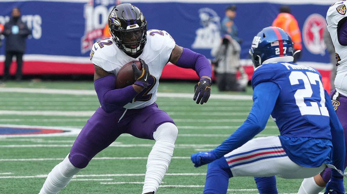 Derrick Henry of the Ravens runs the ball as Jason Pinnock of the Giants tries to line him up in the first half. The Baltimore Ravens came to MetLife Stadium to play the New York Giants.