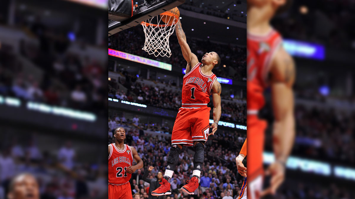 Chicago Bulls Point Guard Derrick Rose (1) Dunks Balls Against New York Knicks during the second half in the United Center. The bulls defeat the Knicks 104-99.