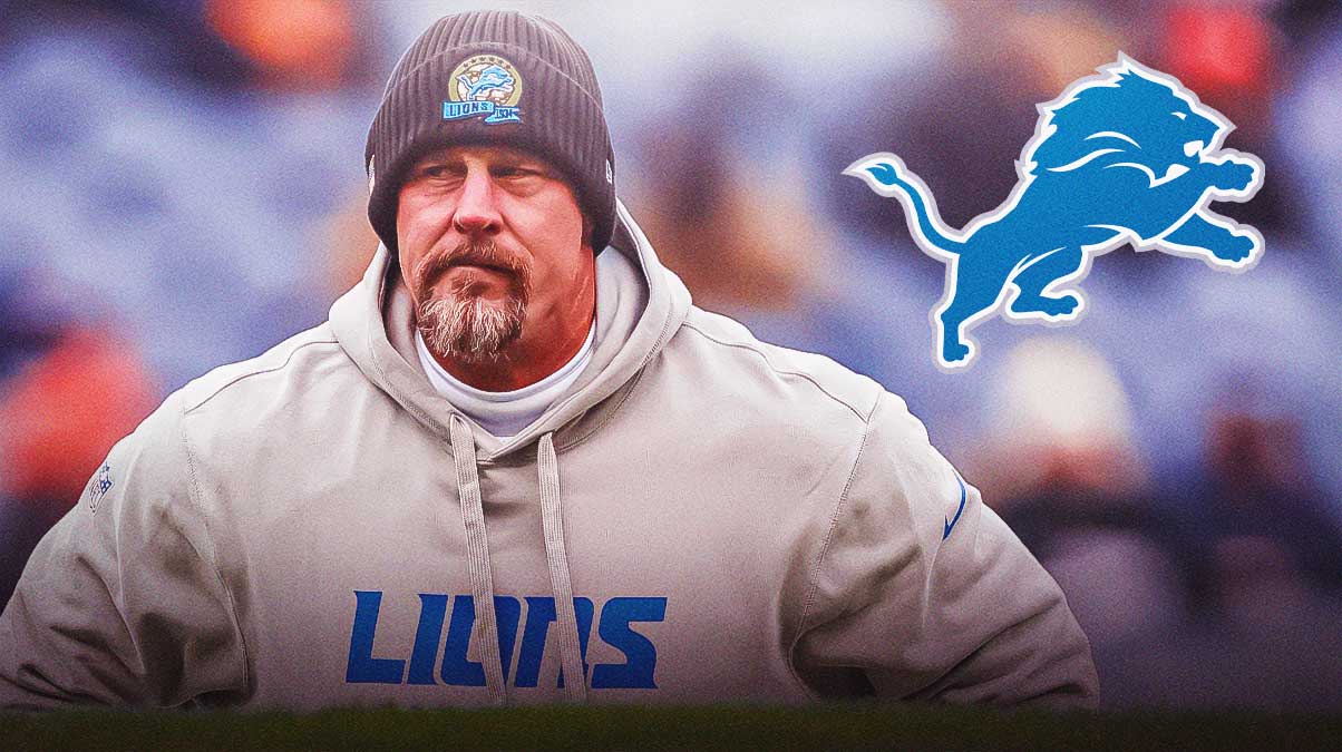Dan Campbell next to Lions logo