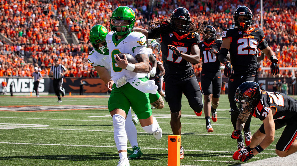 Oregon quarterback Dillon Gabriel runs for a touchdown during his team's game against Oregon State,