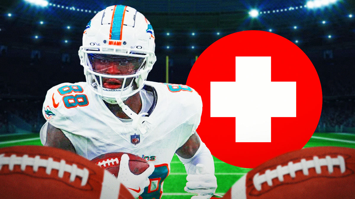 Dolphins WR Grant DuBose with medical Red Cross symbol