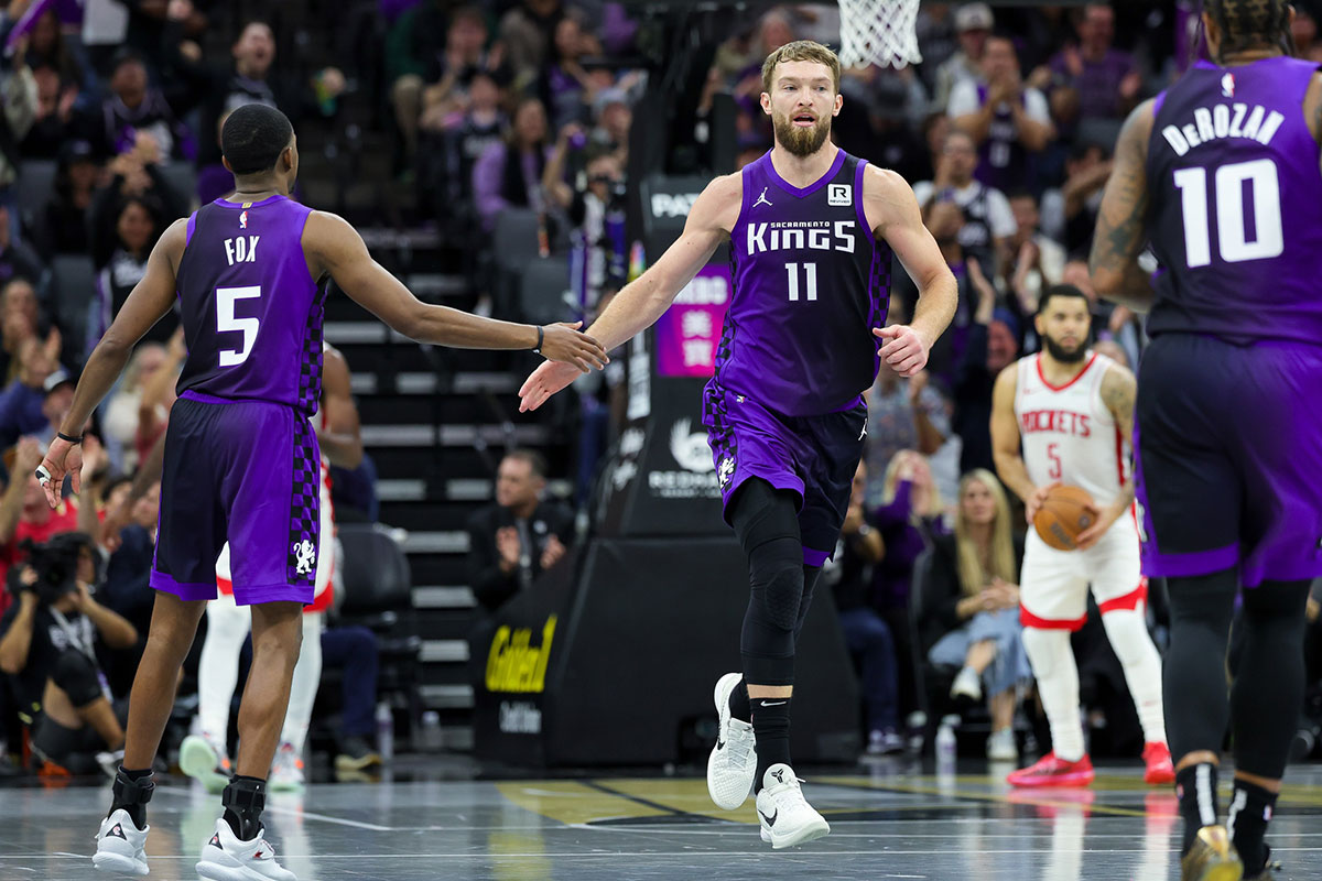 Sacramento Kings forward Domantas Sabonis (11) shakes hands with guard De'Aaron Fox (5) during the fourth quarter against the Houston Rockets at Golden 1 Center.