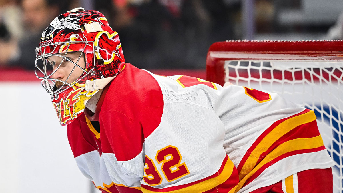 Calgary Flames goalie Dustin Wolf (32) waits for the play to resume against the Ottawa Senators during the third period at Canadian Tire Centre.