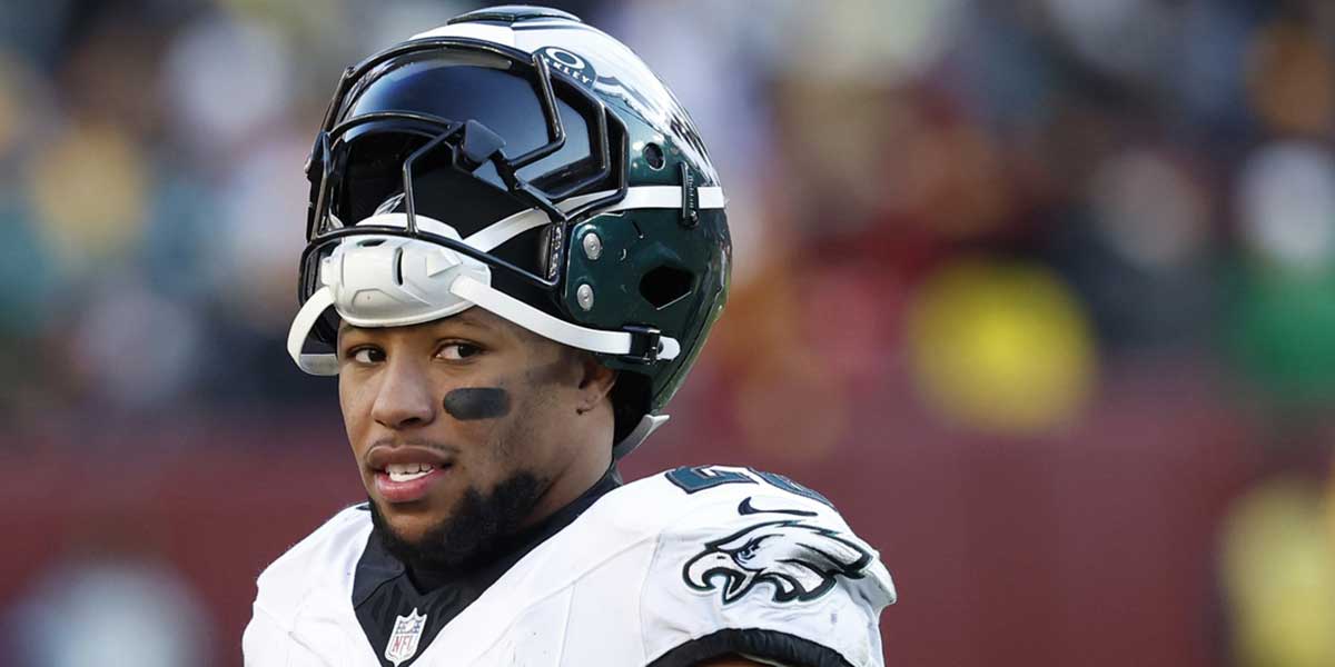 Philadelphia Eagles running back Saquon Barkley (26) stands on the field during a timeout against the Washington Commanders during the third quarter at Northwest Stadium.