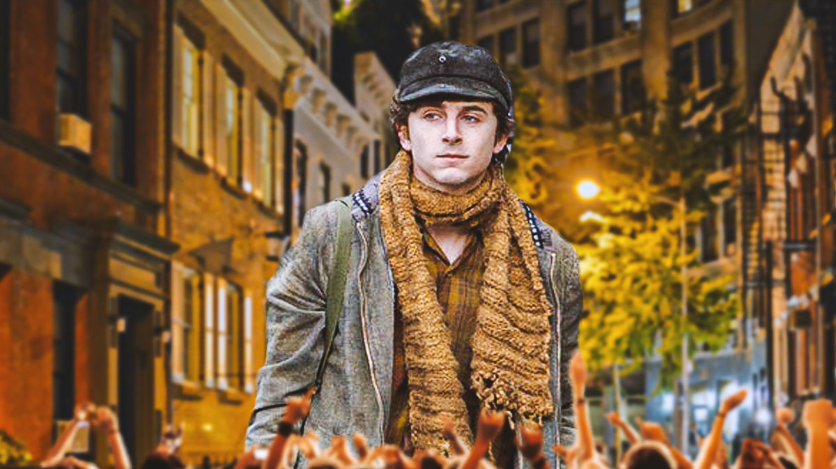 Timothée Chalamet as Bob Dylan in biopic A Complete Unknown with New York City background.