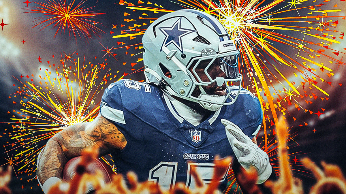 Cowboys Ezekiel Elliott with the ball in his hands and fireworks in the background.