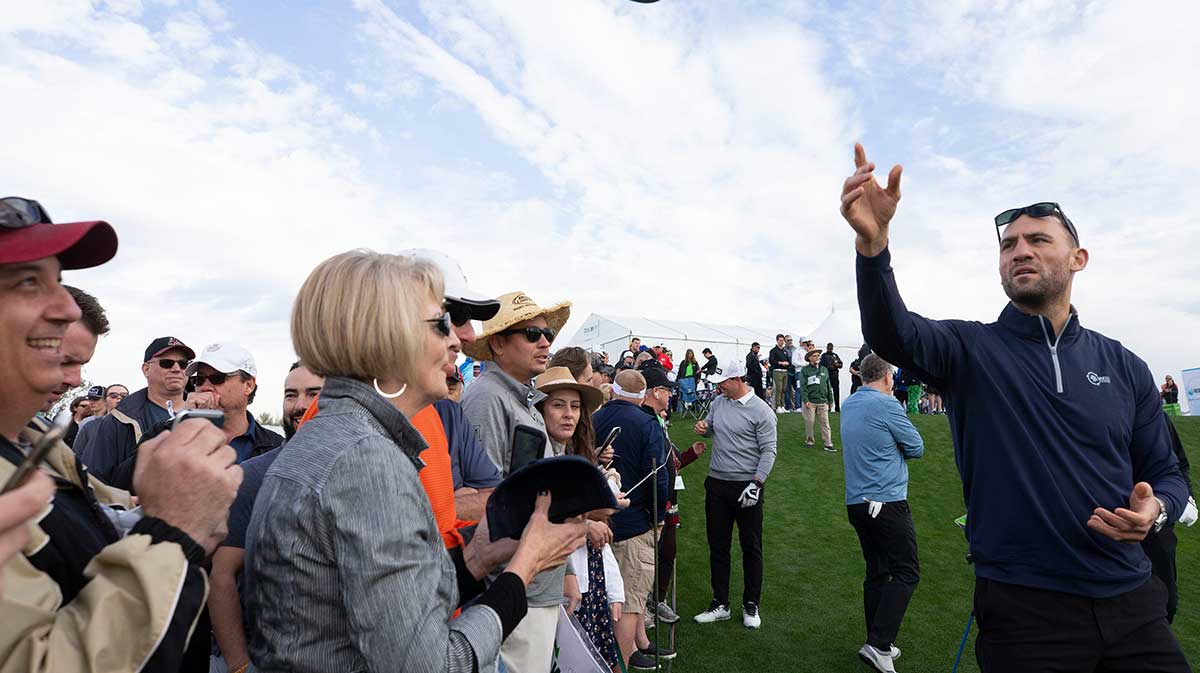 Former Coyote Paul Bissonnette tosses hats to fans on the 10th tee box during the Waste Management Phoenix Open Annexus Pro-Am at TPC Scottsdale Stadium Course.