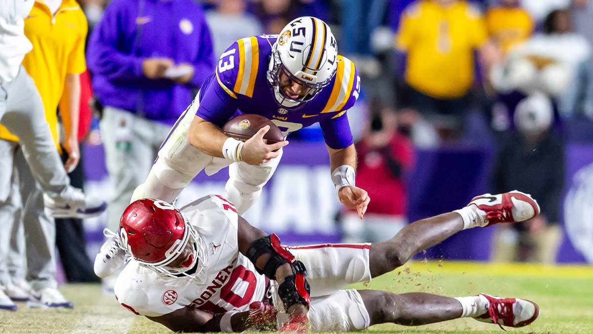 Tigers quarterback Garrett Nussmeier 13 runs the ball as the LSU Tigers take on the Oklahoma Sooners. Nov 30, 2024; Baton Rouge, Louisiana, USA; at Tiger Stadium.