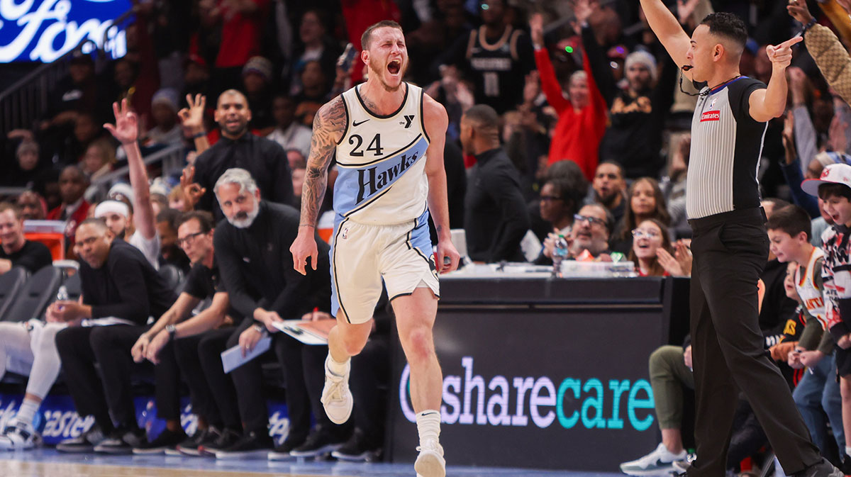 Atlanta Hawks guard Garrison Mathews (24) reacts after a three point basket against the Minnesota Timberwolves in the fourth quarter at State Farm Arena.