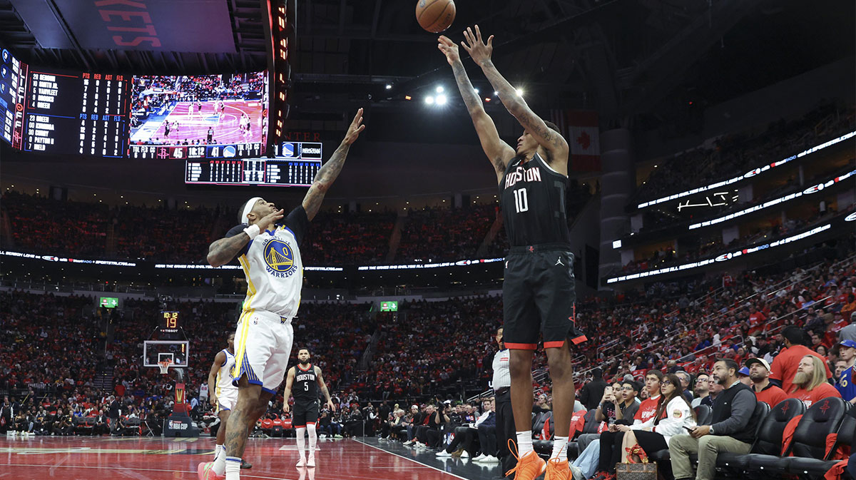 Houston Rockets forward Jabari Smith Jr. (10) shoots the ball as Golden State Warriors guard Gary Payton II (0) defends during the third quarter at Toyota Center.