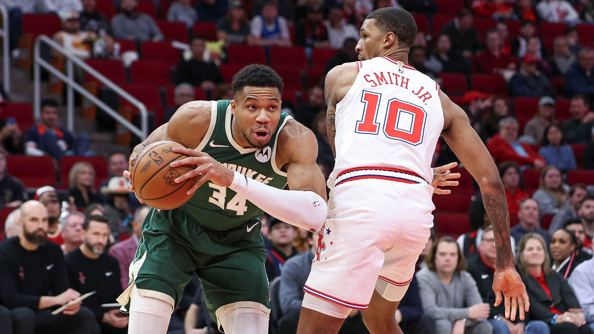 Milwaukee Bucks forward Giannis Antetokounmpo (34) drives to the basket as Houston Rockets forward Jabari Smith Jr. (10) defends during the first quarter at Toyota Center.