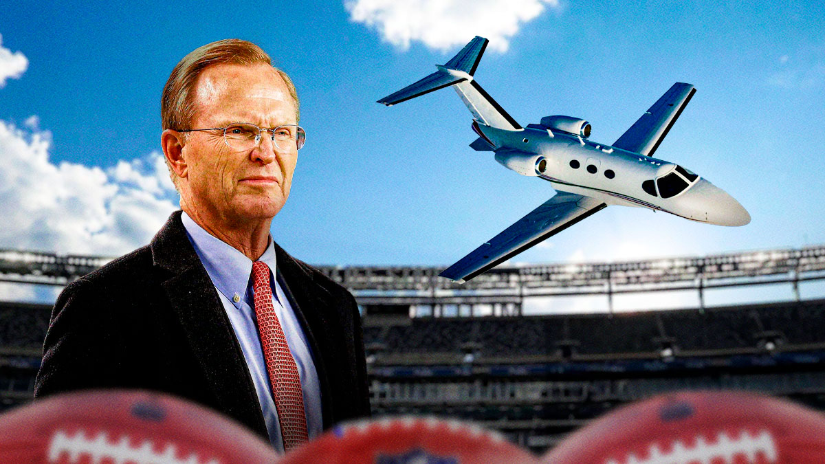 New York Giants owner and president John Mara with a plane above his head