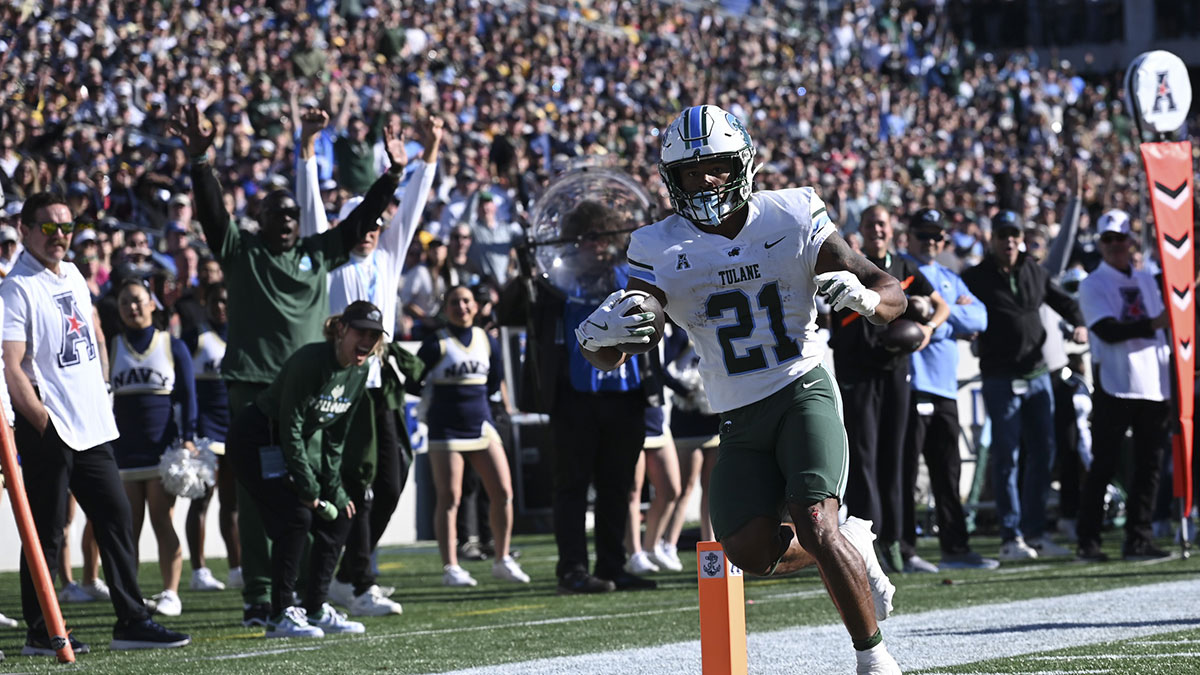Tulane Green Wave running back Makhi Hughes (21) scores a touchdown during the first half against the Navy Midshipmen at Navy-Marine Corps Memorial Stadium.