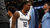 Grizzlies guard Ja Morant (12) walks off the court after being ejected