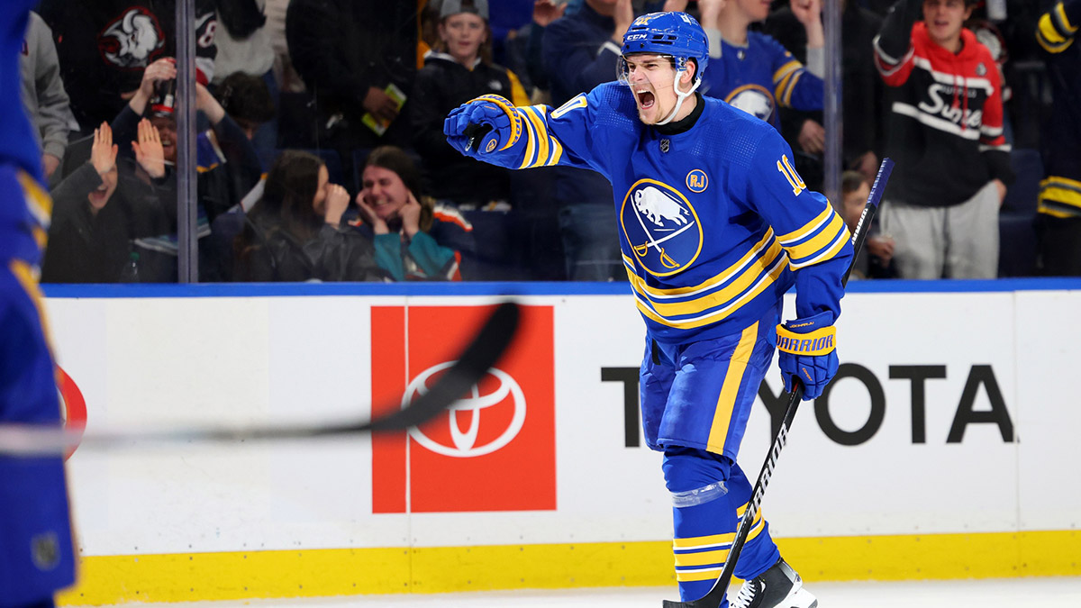 Buffalo Sabres defenseman Henri Jokiharju (10) reacts after his team scores a goal during the second period against the New York Islanders at KeyBank Center.