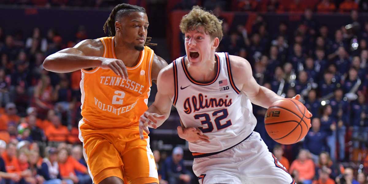 Illinois Fighting Illini guard Kasparas Jakucionis (32) drives the ball against Tennessee Volunteers guard Chaz Lanier (2) during the first half at State Farm Center.